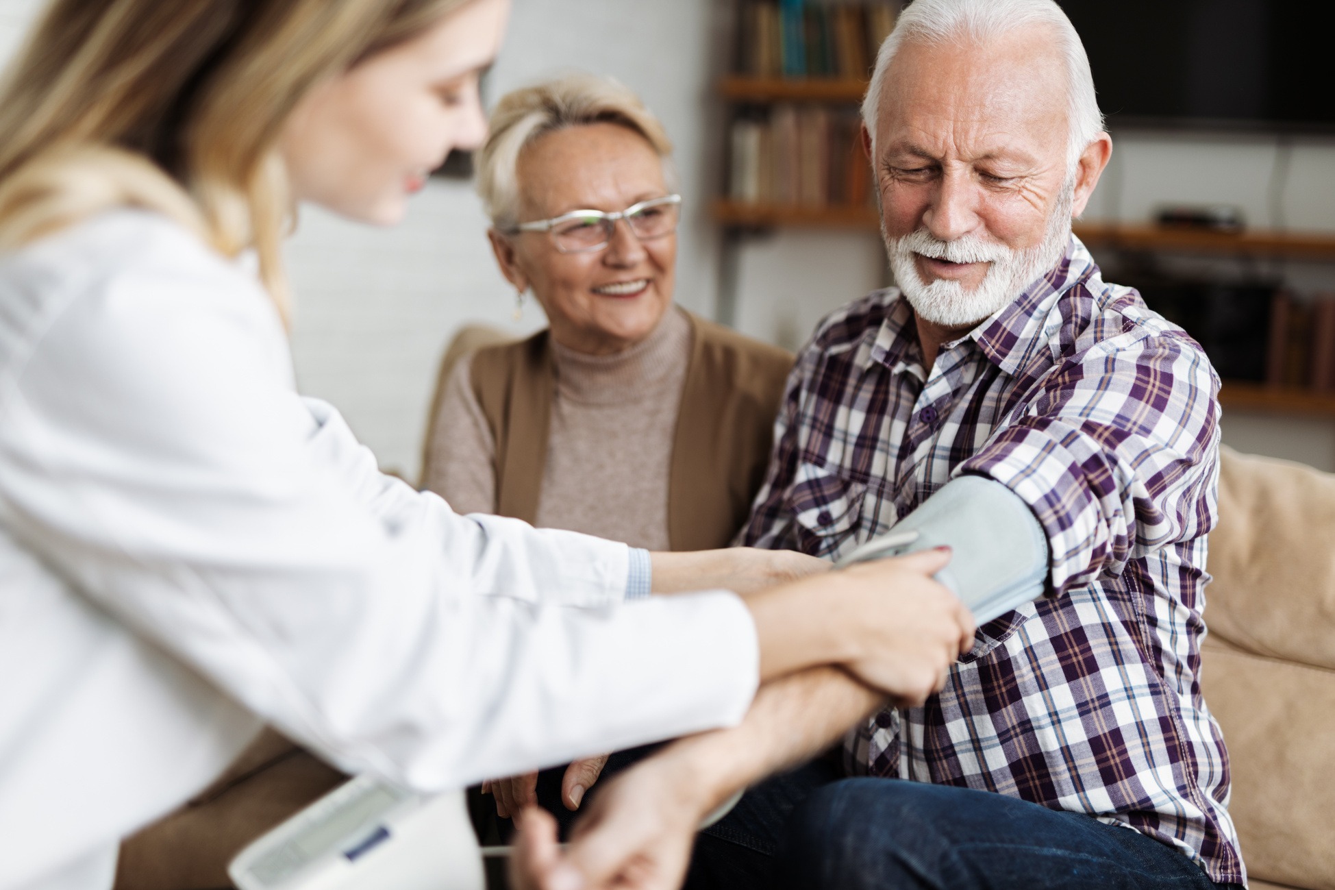 Smiling couple reviewing Medicare options together